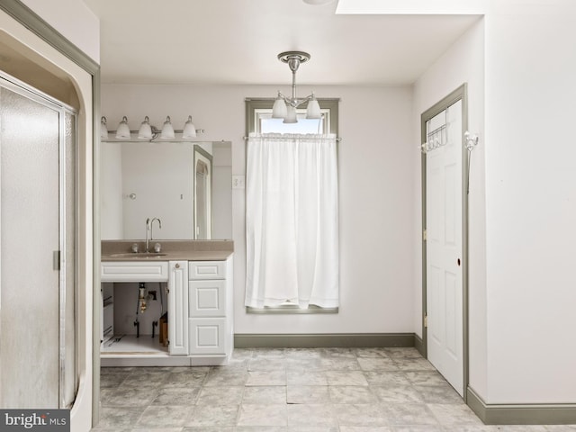 full bathroom featuring vanity and baseboards