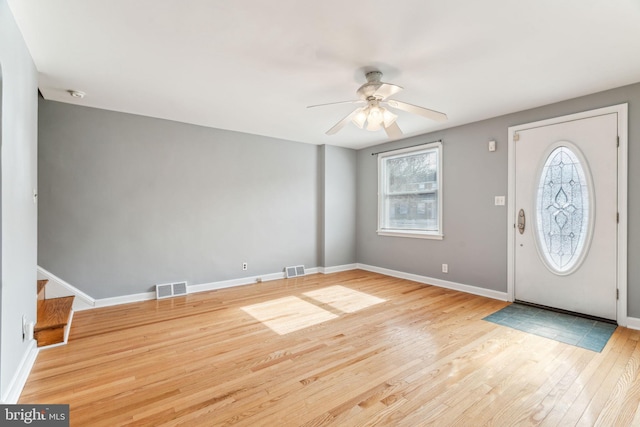 foyer with plenty of natural light, visible vents, and wood finished floors