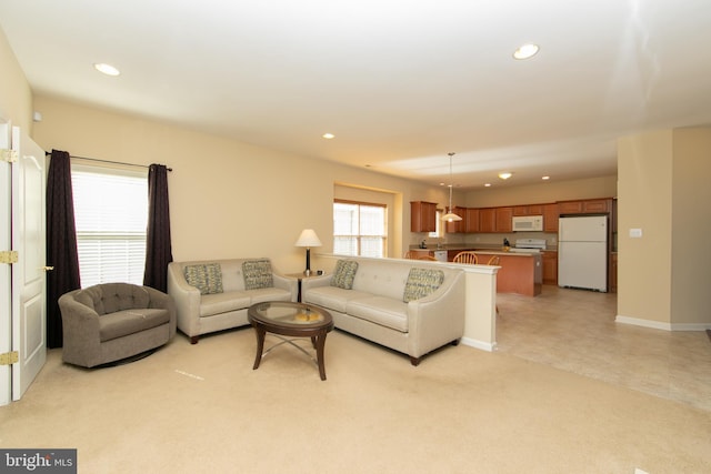 living room featuring recessed lighting and baseboards