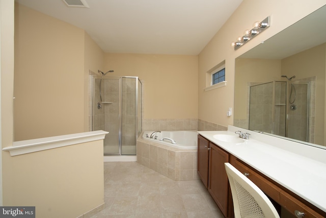 bathroom with a stall shower, visible vents, a garden tub, and vanity