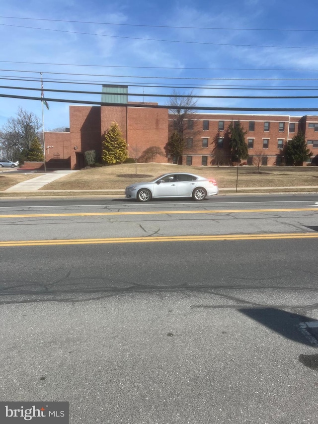 view of street featuring curbs and sidewalks