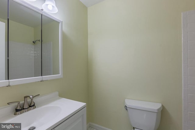 bathroom with toilet and vanity