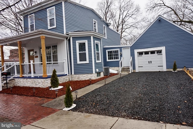 view of property exterior featuring driveway and a porch