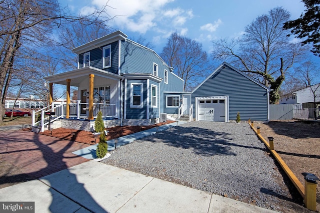 view of front of house with central air condition unit, covered porch, a garage, fence, and driveway