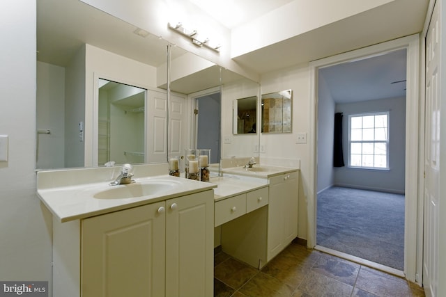 full bathroom with a sink and double vanity