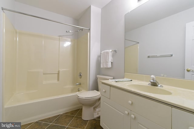 full bath with shower / washtub combination, vanity, toilet, and tile patterned floors