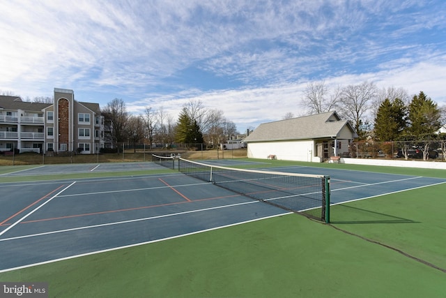 view of sport court with fence