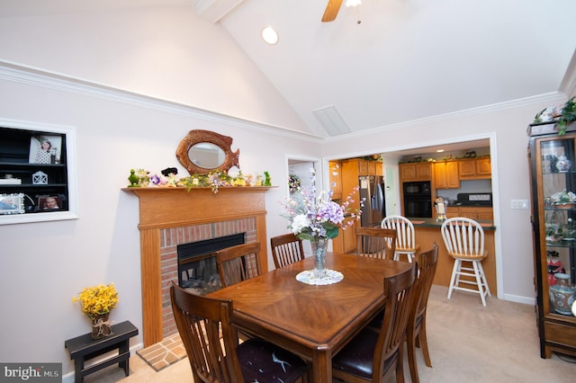 9 Holly Ter, Cambridge, MD 21613 - dining room with high vaulted ceiling, ornamental molding, baseboards, light colored carpet, and a brick fireplace