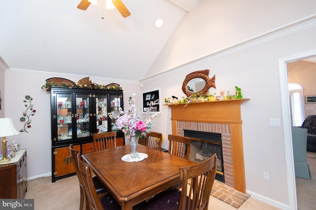 9 Holly Ter, Cambridge, MD 21613 - dining area with lofted ceiling, a brick fireplace, baseboards, and light carpet