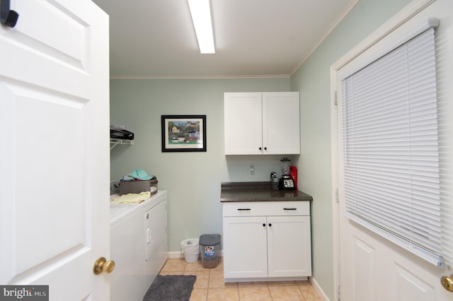 9 Holly Ter, Cambridge, MD 21613 - washroom with baseboards, light tile patterned flooring, cabinet space, crown molding, and washing machine and dryer