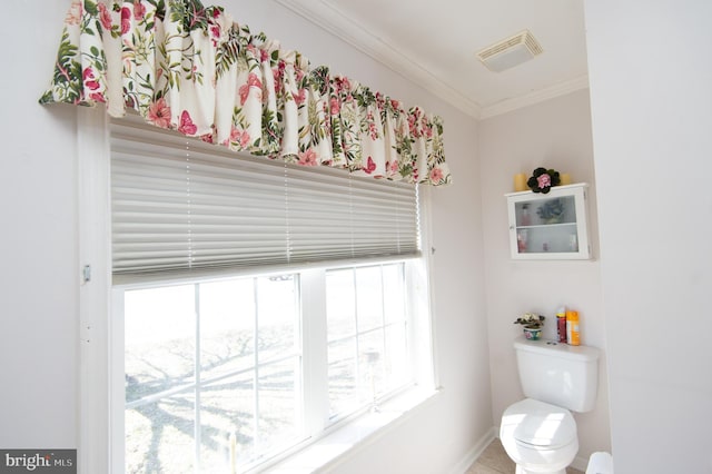 9 Holly Ter, Cambridge, MD 21613 - bathroom featuring visible vents, toilet, crown molding, and baseboards