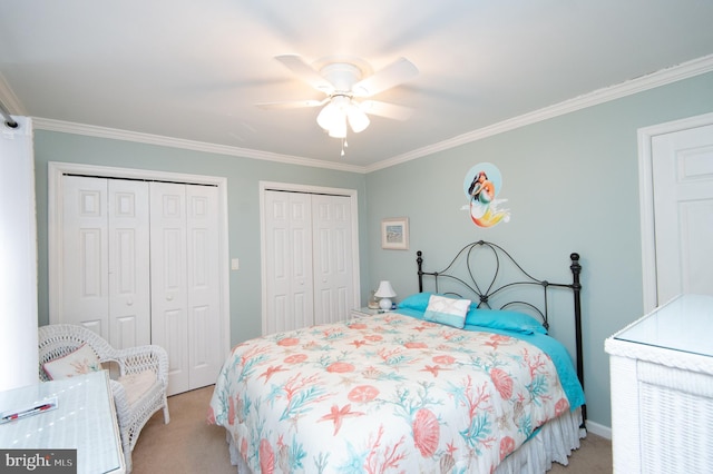9 Holly Ter, Cambridge, MD 21613 - bedroom with crown molding, a ceiling fan, two closets, and light carpet
