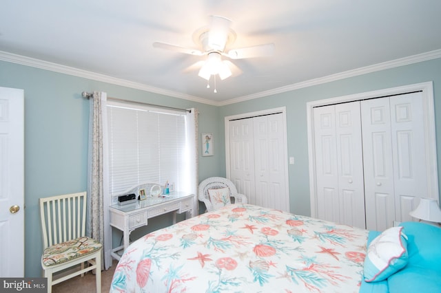 9 Holly Ter, Cambridge, MD 21613 - bedroom featuring a ceiling fan, multiple closets, and ornamental molding