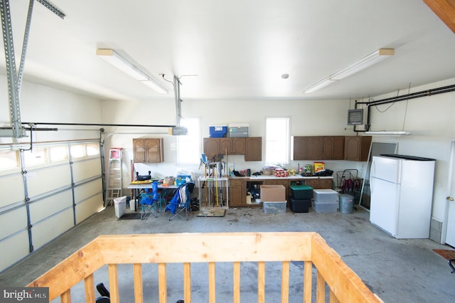 9 Holly Ter, Cambridge, MD 21613 - garage featuring a garage door opener and freestanding refrigerator