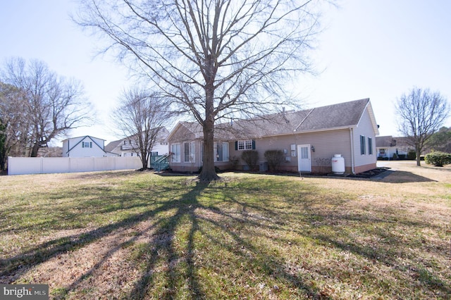 9 Holly Ter, Cambridge, MD 21613 - rear view of property with a lawn and fence