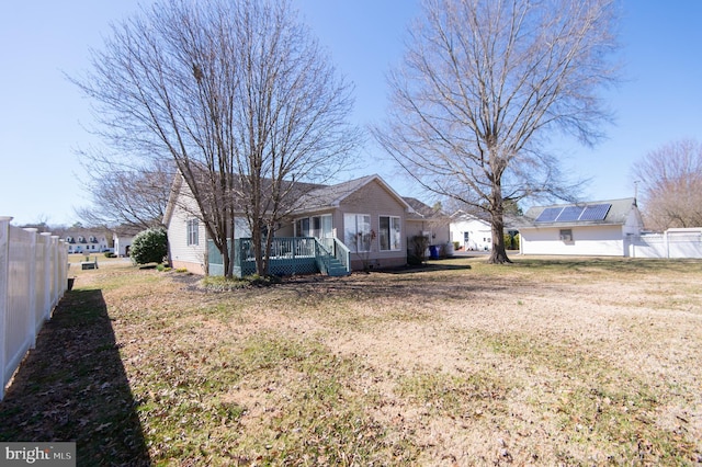 9 Holly Ter, Cambridge, MD 21613 - exterior space featuring a wooden deck, a front lawn, and fence