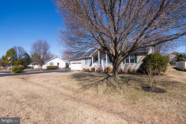 9 Holly Ter, Cambridge, MD 21613 - view of front of property featuring a front lawn, an attached garage, and driveway
