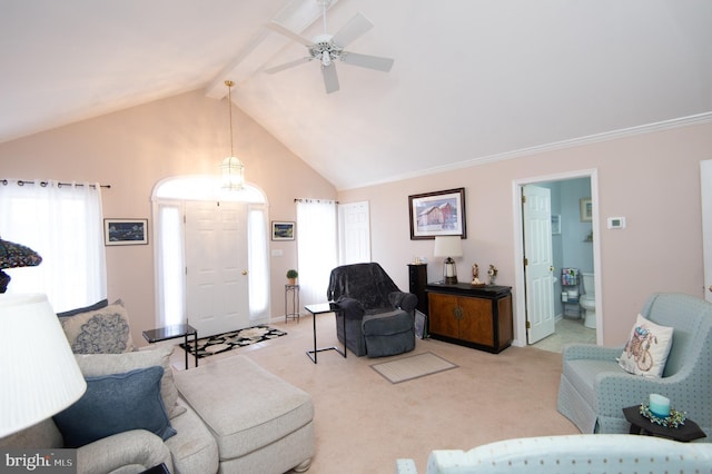9 Holly Ter, Cambridge, MD 21613 - living area featuring lofted ceiling with beams, a ceiling fan, and light carpet