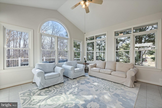 sunroom featuring ceiling fan and vaulted ceiling