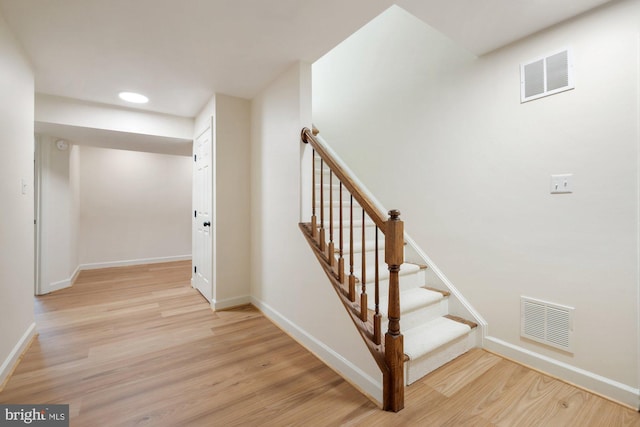 stairs featuring recessed lighting, wood finished floors, visible vents, and baseboards