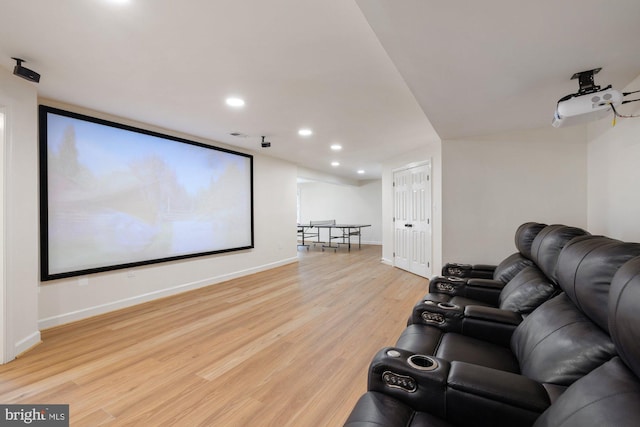 home theater featuring recessed lighting, light wood-type flooring, and baseboards