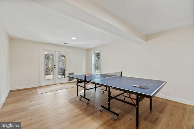 rec room featuring french doors, light wood-type flooring, and baseboards