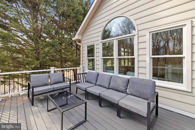 wooden deck featuring an outdoor living space