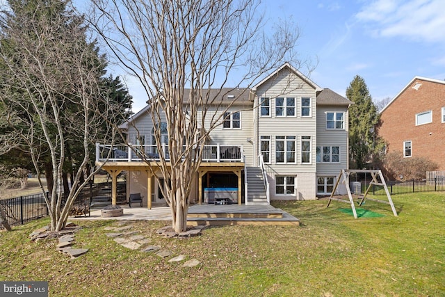 back of house with stairs, a lawn, a fenced backyard, a deck, and a patio