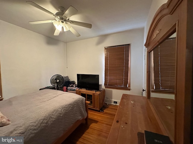 bedroom featuring light wood-type flooring and ceiling fan