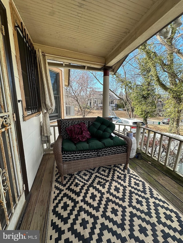 wooden deck featuring covered porch