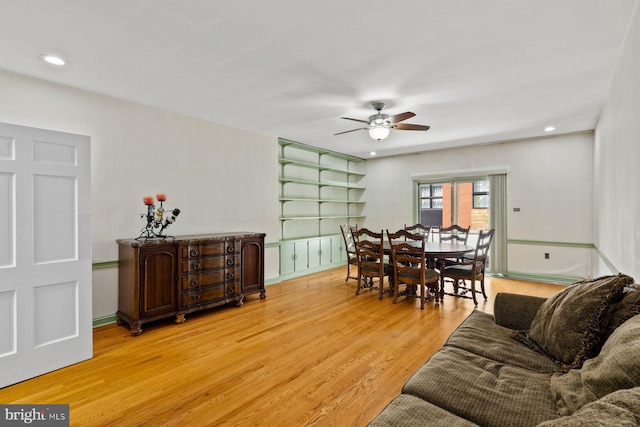 living area featuring light wood finished floors, ceiling fan, baseboards, and recessed lighting