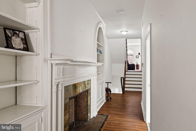 interior space with dark wood-style floors and stairs