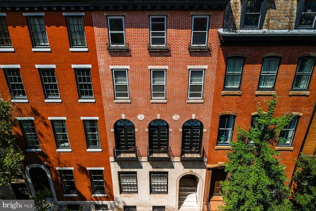 townhome / multi-family property with brick siding