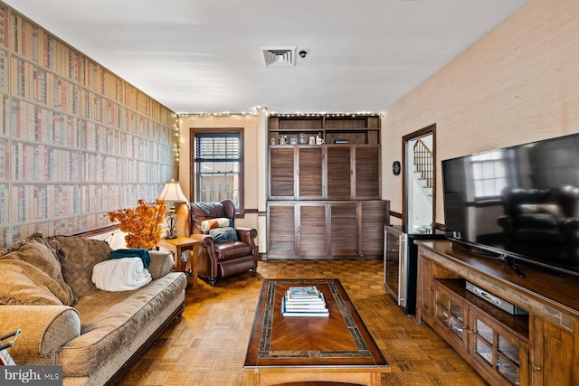 living room featuring visible vents