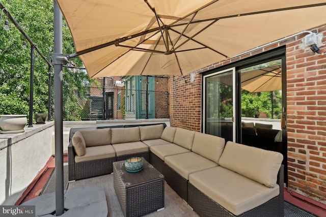 view of patio featuring fence and an outdoor living space