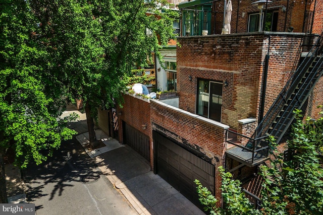 view of property exterior with brick siding