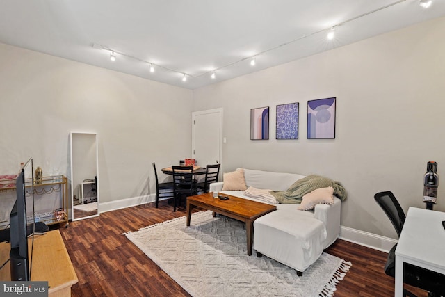 office area with baseboards and wood finished floors