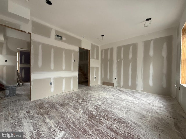 unfurnished living room with stairs