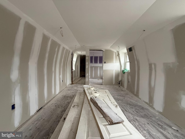 spare room with vaulted ceiling