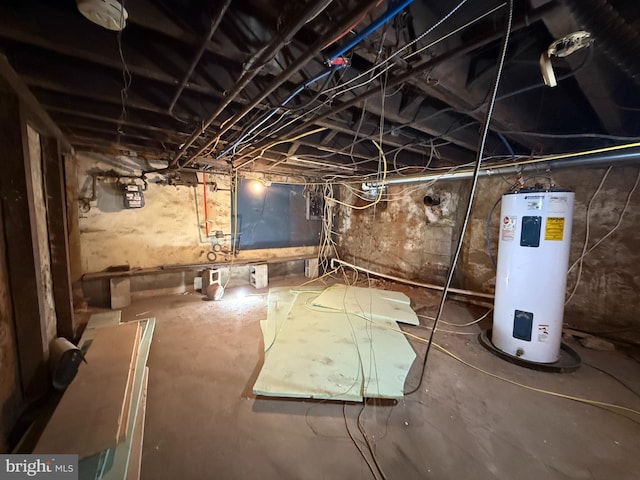 unfinished below grade area featuring water heater