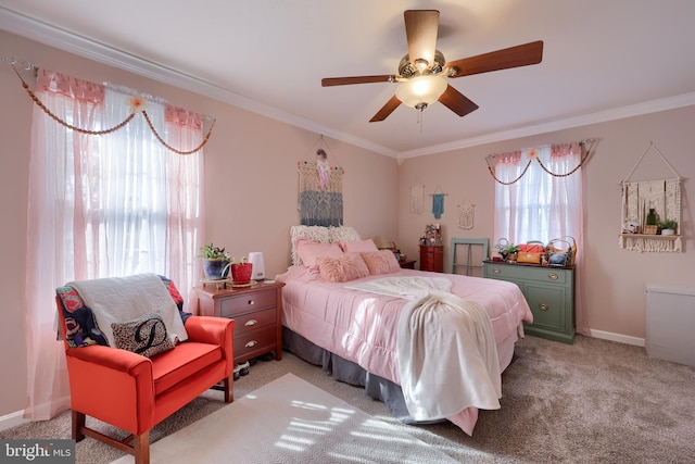 bedroom featuring baseboards, light carpet, a ceiling fan, and crown molding