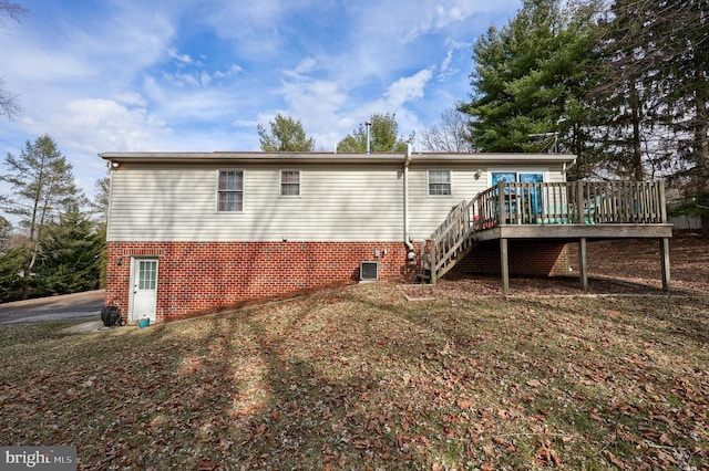 rear view of house featuring stairway, central AC, and a deck