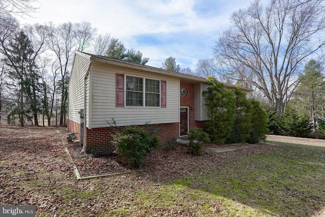 split foyer home with brick siding