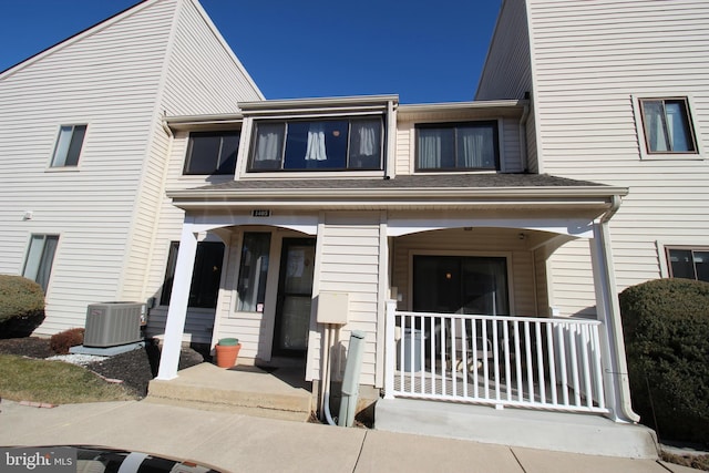 townhome / multi-family property featuring covered porch and central AC