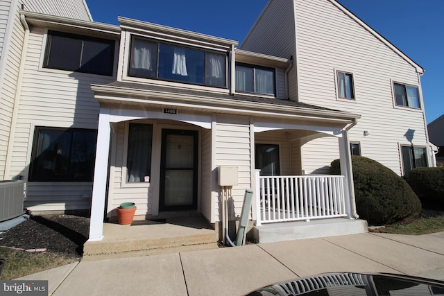 view of front of property featuring a porch and central AC