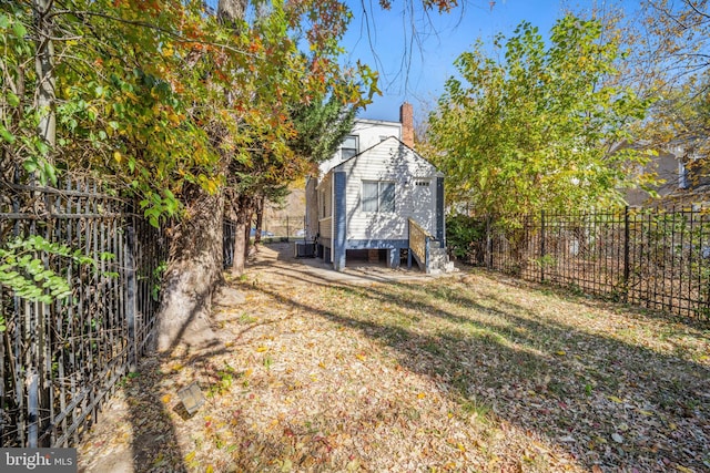 view of outbuilding featuring an outbuilding and fence