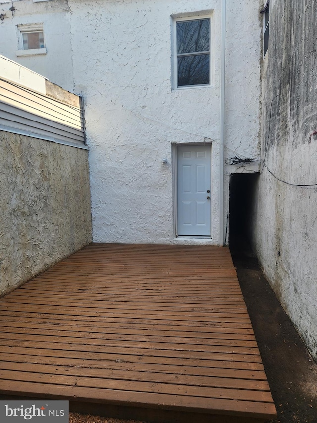 view of exterior entry with stucco siding