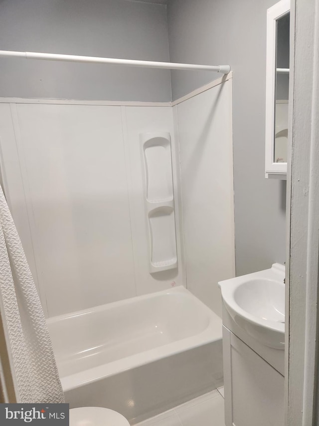 bathroom featuring shower / tub combo, tile patterned flooring, and vanity