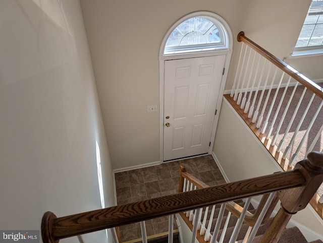 foyer entrance with baseboards