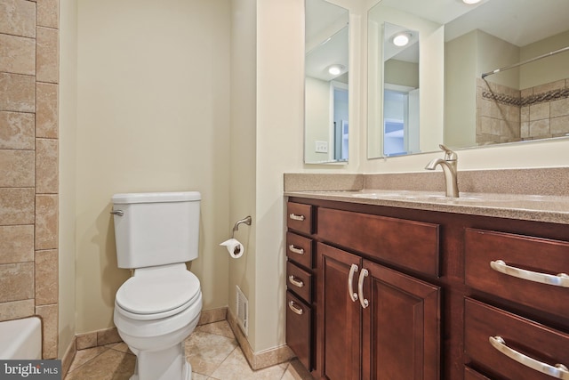 bathroom featuring vanity, baseboards, a shower, tile patterned floors, and toilet